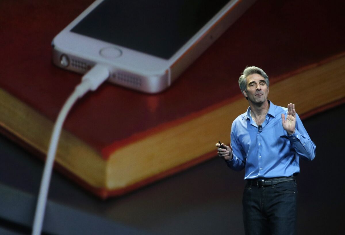 Apple executive Craig Federighi speaks during an Apple media event in 2014. (Karl Mondon / Bay Area News Group/MCT)