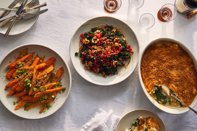 Dishes with glazed carrots; warm kale salad and creamy chard.