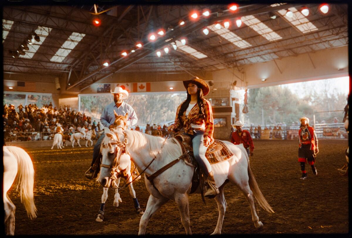 Riders at the Bill Pickett Invitational Rodeo at the Industry Hills Expo Center in West Covina last year.