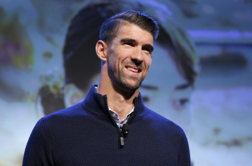 Michael Phelps speaks during a conference before the CES tech show in Las Vegas.
