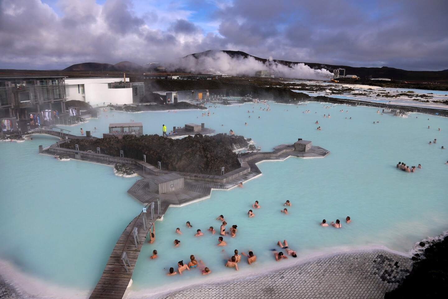Visitors sit in the geothermal waters at the Blue Lagoon close to the Icelandic capital of Reykjavik.