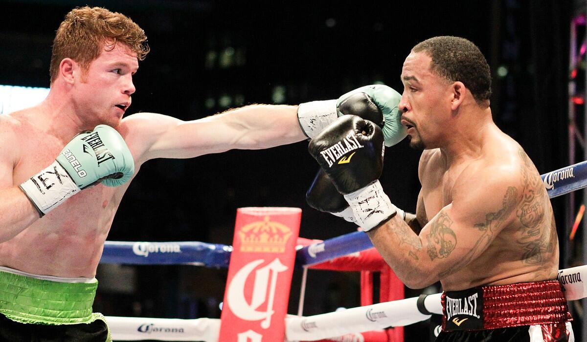 Saul "Canelo" Alvarez, left, lands a a jab to the face of James Kirkland during a 154-pound fight on Saturday, May 9.