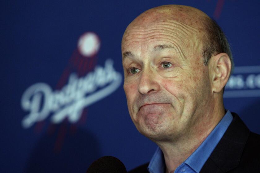 Dodgers CEO and President Stan Kasten, shown in January, says the team hopes the farm system will eventually help reduce the payroll.