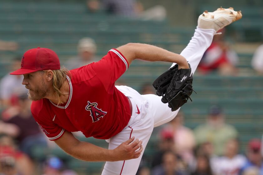 Los Angeles Angels starting pitcher Noah Syndergaard throws against the Oakland Athletics during the first inning of a spring training baseball game, Monday, March 28, 2022, in Tempe, Ariz. (AP Photo/Matt York)