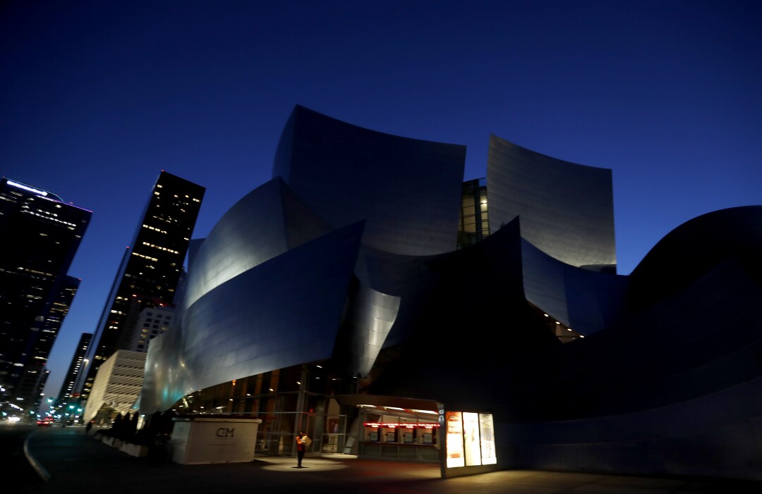 The Walt Disney Concert Hall is dark. The popular entertainment venue has temporarily shut down as a safety precaution against the spread of the coronavirus. 