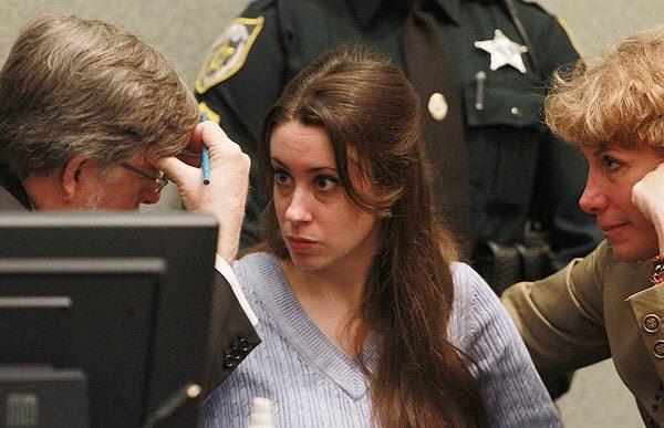 Casey Anthony talks with her attorneys before the start of her sentencing hearing at the Orange County Courthouse in Orlando, Fla., Thursday. Anthony was found guilty of lying to law enforcement officers but not guilty of murder charges.