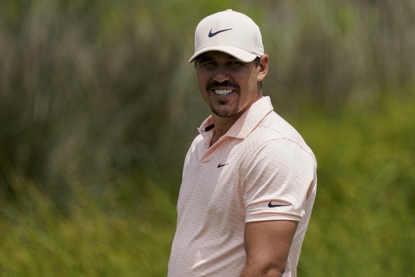 Brooks Koepka smiles on the 12th hole during a practice round at the PGA Championship golf tournament on the Ocean Course Tuesday, May 18, 2021, in Kiawah Island, S.C. (AP Photo/Matt York)