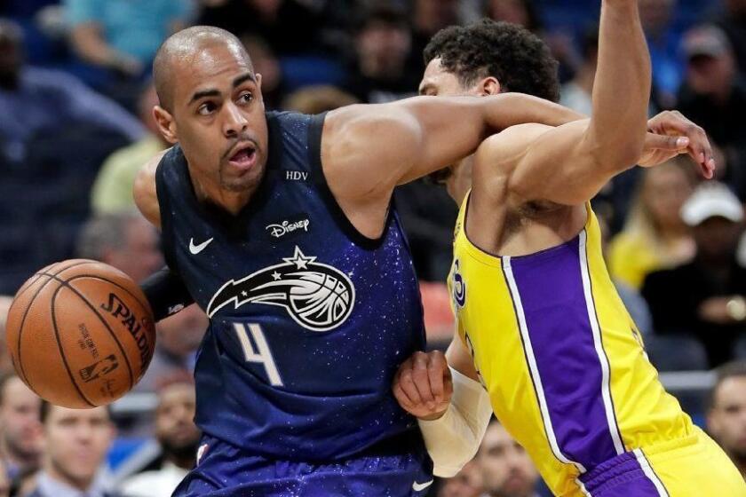 Orlando Magic's Arron Afflalo, left, is called for an offensive foul as he tries to push his way past Los Angeles Lakers' Jordan Clarkson during the second half of an NBA basketball game, Wednesday, Jan. 31, 2018, in Orlando, Fla. Orlando won 127-105. (AP Photo/John Raoux)