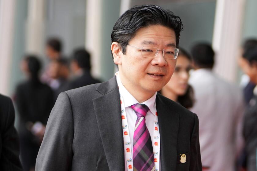 FILE - Singapore's Deputy Prime Minister and Finance Minister Lawrence Wong arrives to attend G-20's third Finance Ministers and Central Bank Governors (FMCBGs) meeting in Gandhinagar, India on July 17, 2023. Singapore’s deputy leader Wong is set to be sworn in Wednesday, May 15, 2024, as the nation’s fourth prime minister in a carefully planned political succession designed to ensure continuity and stability in the Asian financial hub. (AP Photo/Ajit Solanki, File)