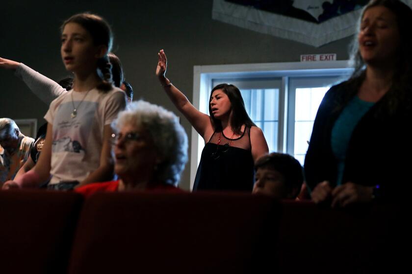 WILDOMAR-CA-JULY 26, 2020: Worshippers including Cindy Medina, center, gather for church service at Bundy Canyon Christian Church in Wildomar on Sunday, July 26, 2020.(Christina House / Los Angeles Times)