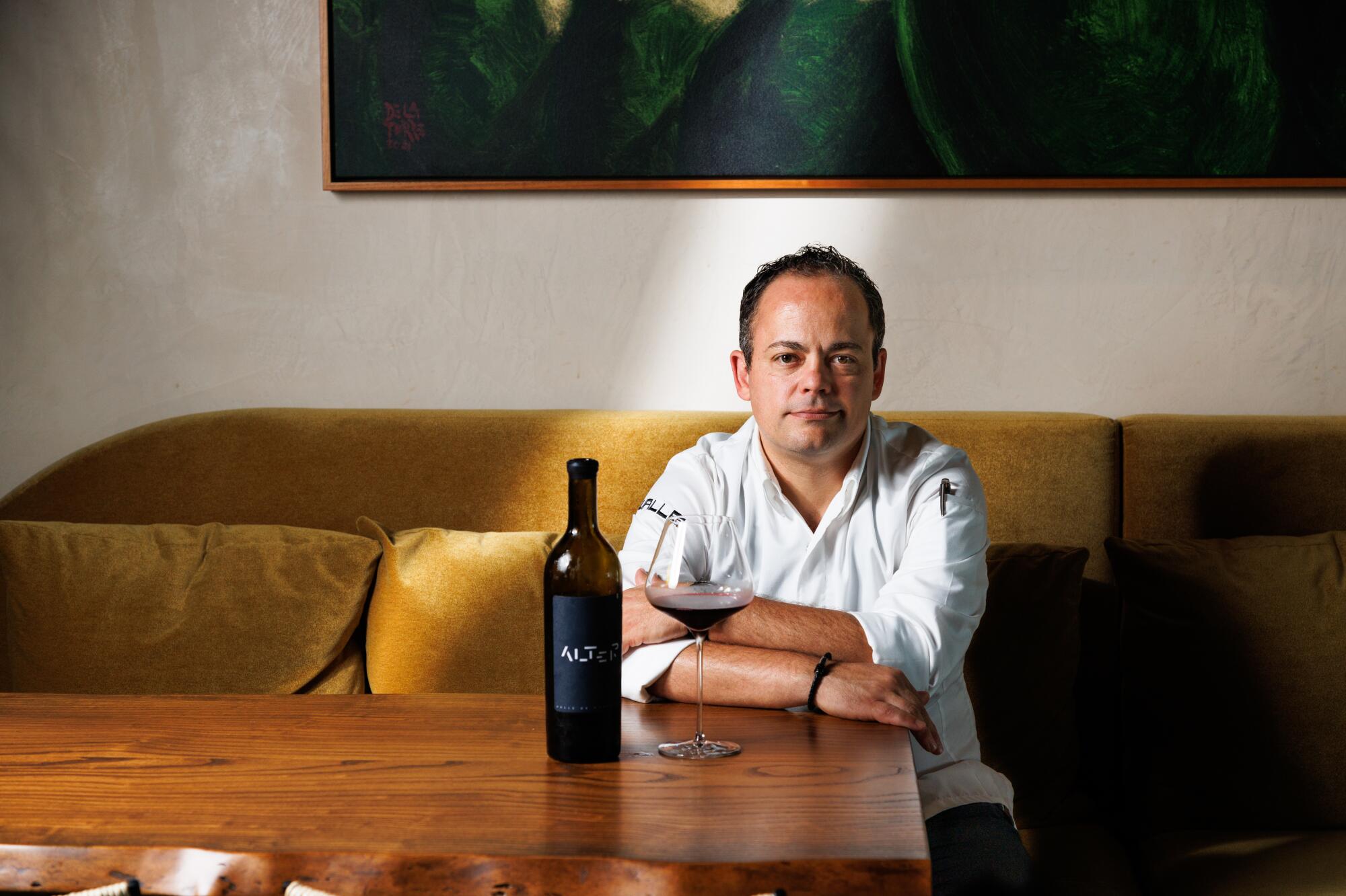 Chef Roberto Alcocer with his own Baja-made wine at Valle. 