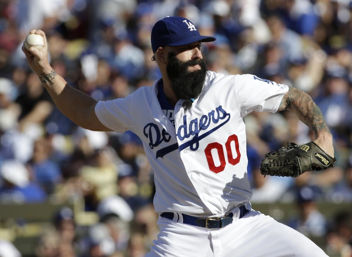 Reliever Brian Wilson will be returning to the Dodgers bullpen in 2014.
