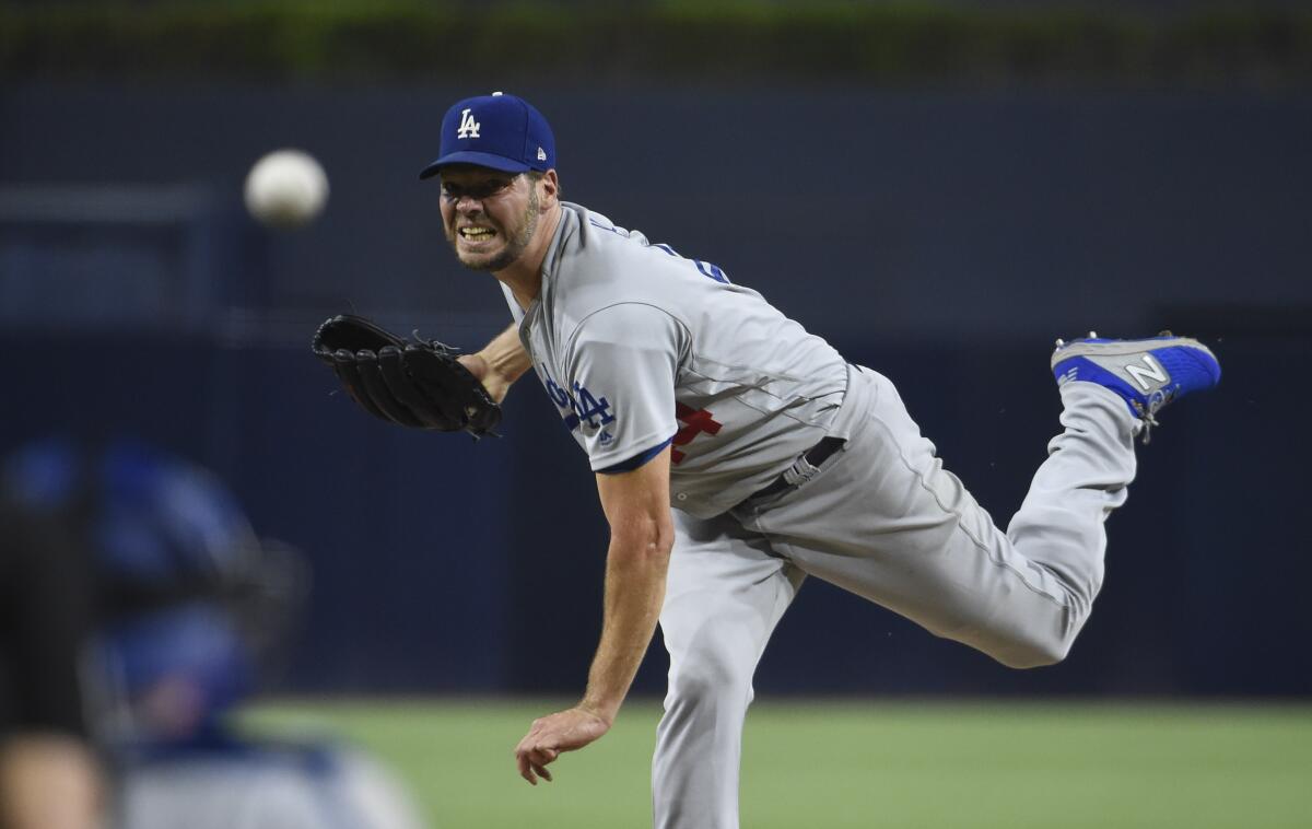 Dodgers' Rich Hill delivers a pitch against the Padres.