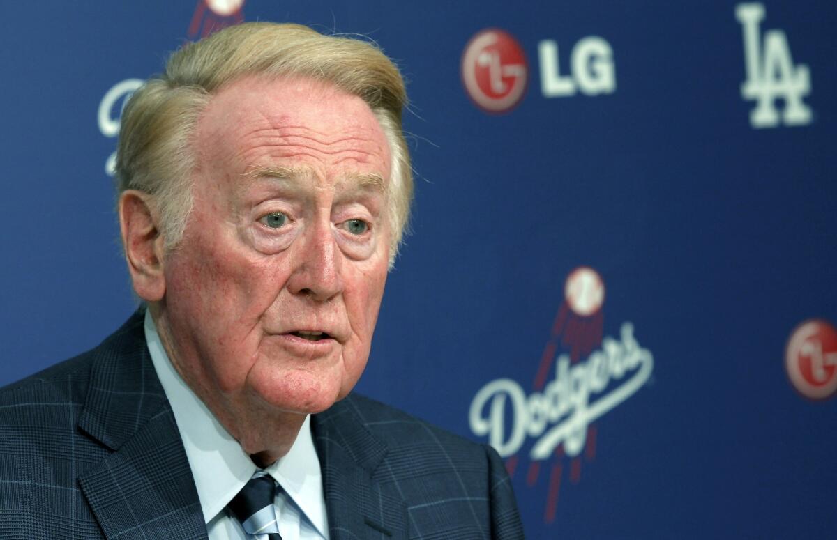 Longtime Dodgers broadcaster Vin Scully speaks during a news conference.