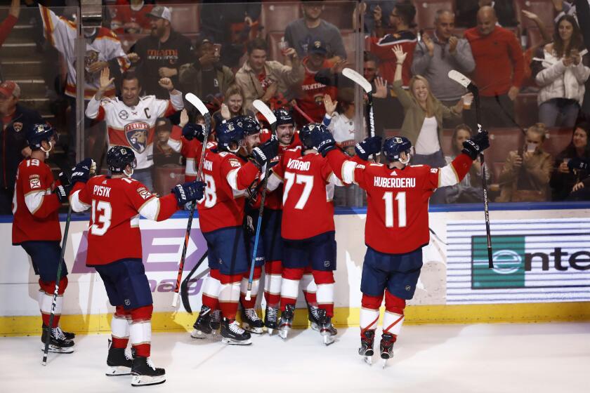 The Florida Panthers celebrate after scoring in overtime during an NHL hockey game against the Anaheim Ducks, Thursday, Nov. 21, 2019, in Sunrise, Fla. Panthers win 5-4. (AP Photo/Brynn Anderson)