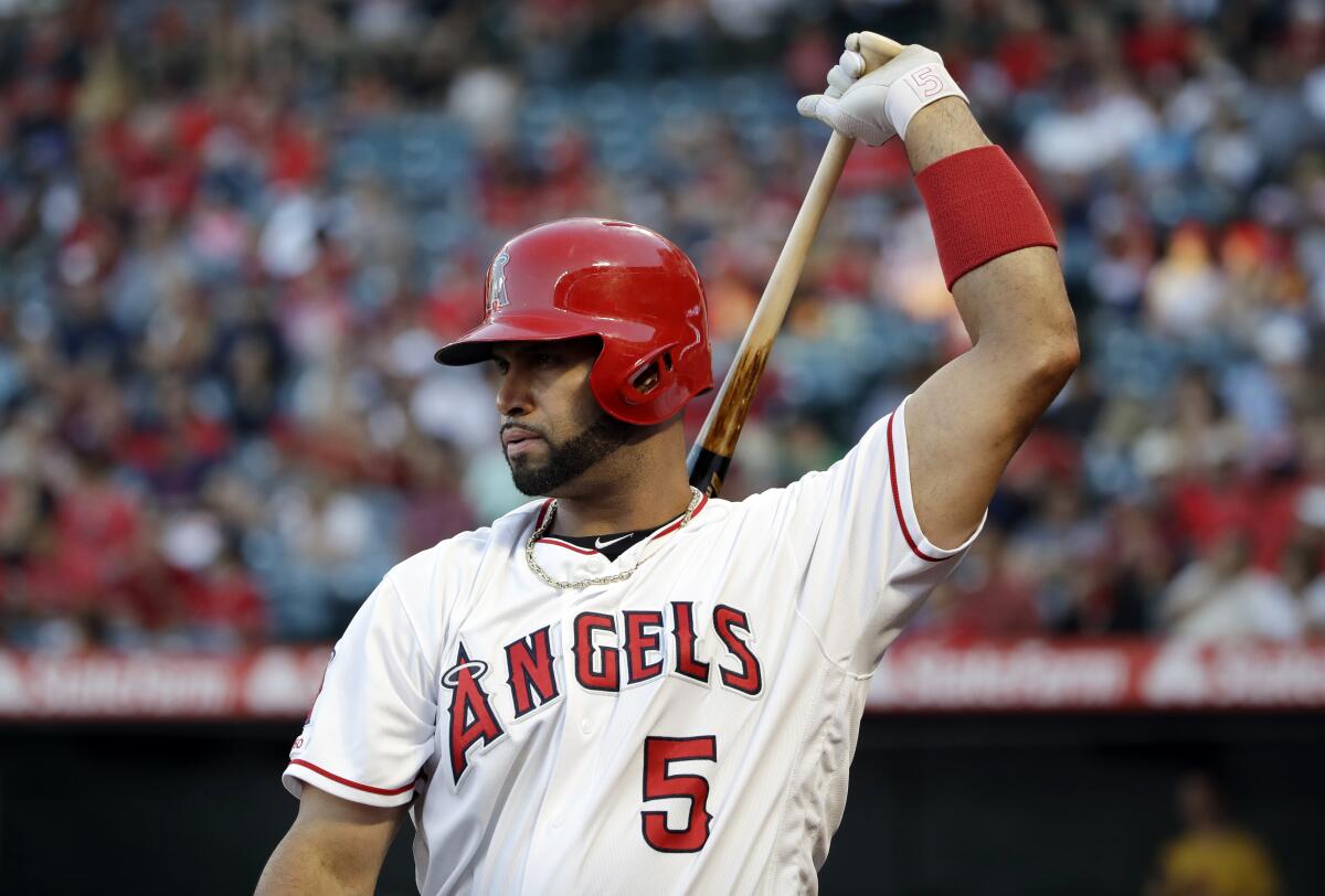 Angels' Albert Pujols prepares to bat against the Oakland Athletics.