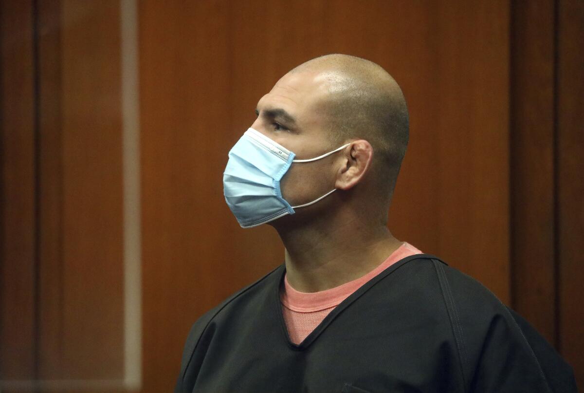 Cain Velasquez wears a mask in court.