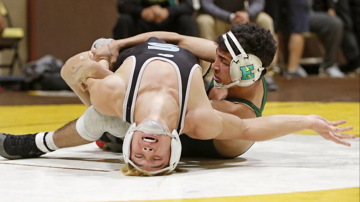 Edison High senior Elijah Palacio, right, competes in a 132-pound match during the first day of the CIF Southern Section Masters meet at Temecula Valley High on Friday.