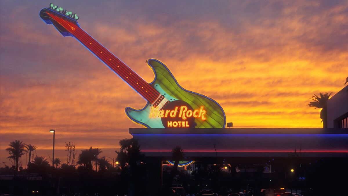 The huge neon guitar once stood atop the Hard Rock Hotel and Casiono in Las Vegas. The hotel is closing, and the sign is now at the Neon Museum.