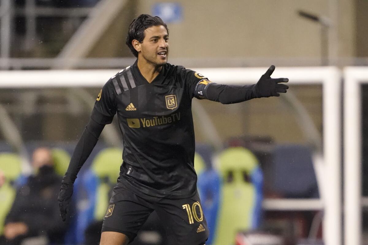 Los Angeles FC forward Carlos Vela motions during the second half of an MLS playoff soccer match.