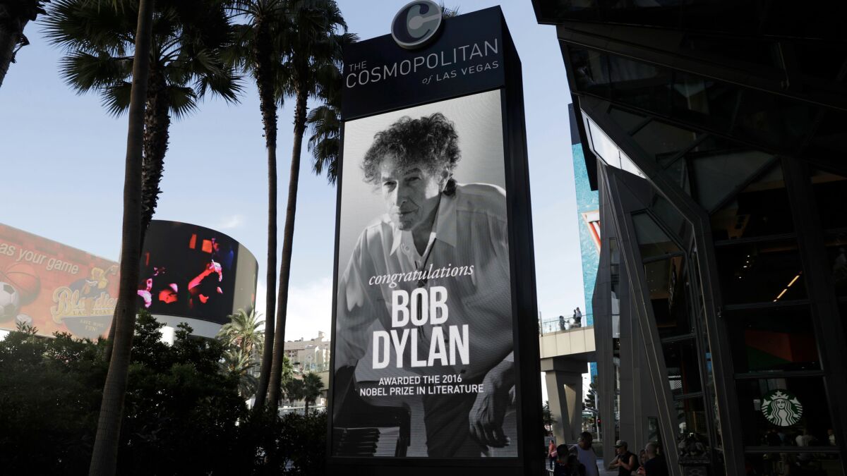 A sign outside of the Cosmopolitan of Las Vegas on Oct. 13 congratulates Bob Dylan after he won the 2016 Nobel Prize in literature.
