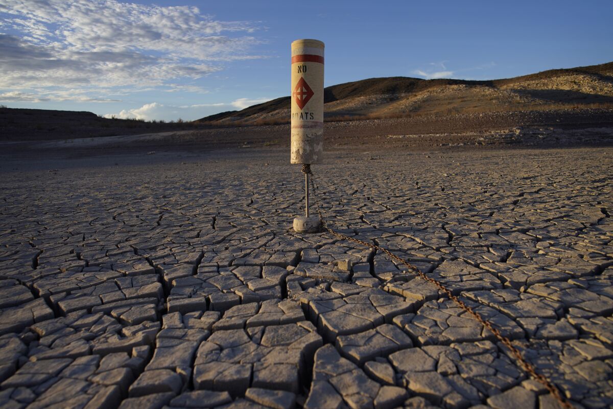 A buoy sits on a lake bed that was once covered by Colorado River water at Lake Mead on June 28, 2022.