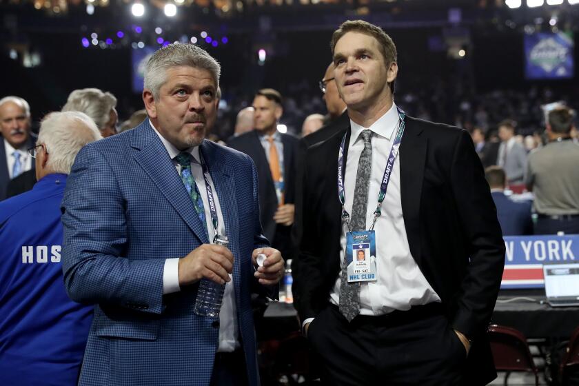 VANCOUVER, BRITISH COLUMBIA - JUNE 21: Todd McLellan and Luc Robitaille of the Los Angeles Kings attend the first round of the 2019 NHL Draft at Rogers Arena on June 21, 2019 in Vancouver, Canada. (Photo by Bruce Bennett/Getty Images)