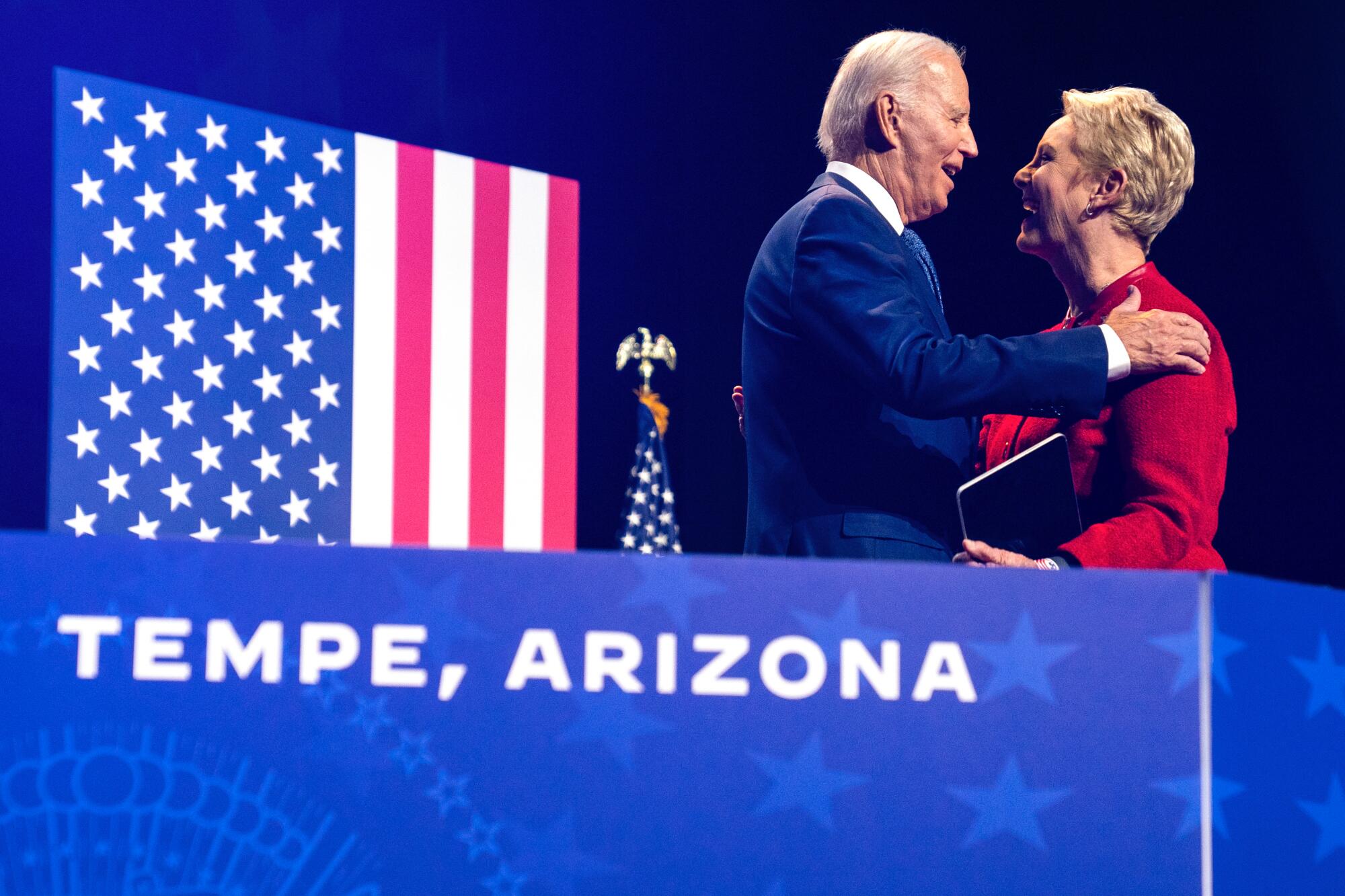 Cindy McCain, wife of the late Sen. John McCain, greets President Joe Biden in Tempe, Ariz.