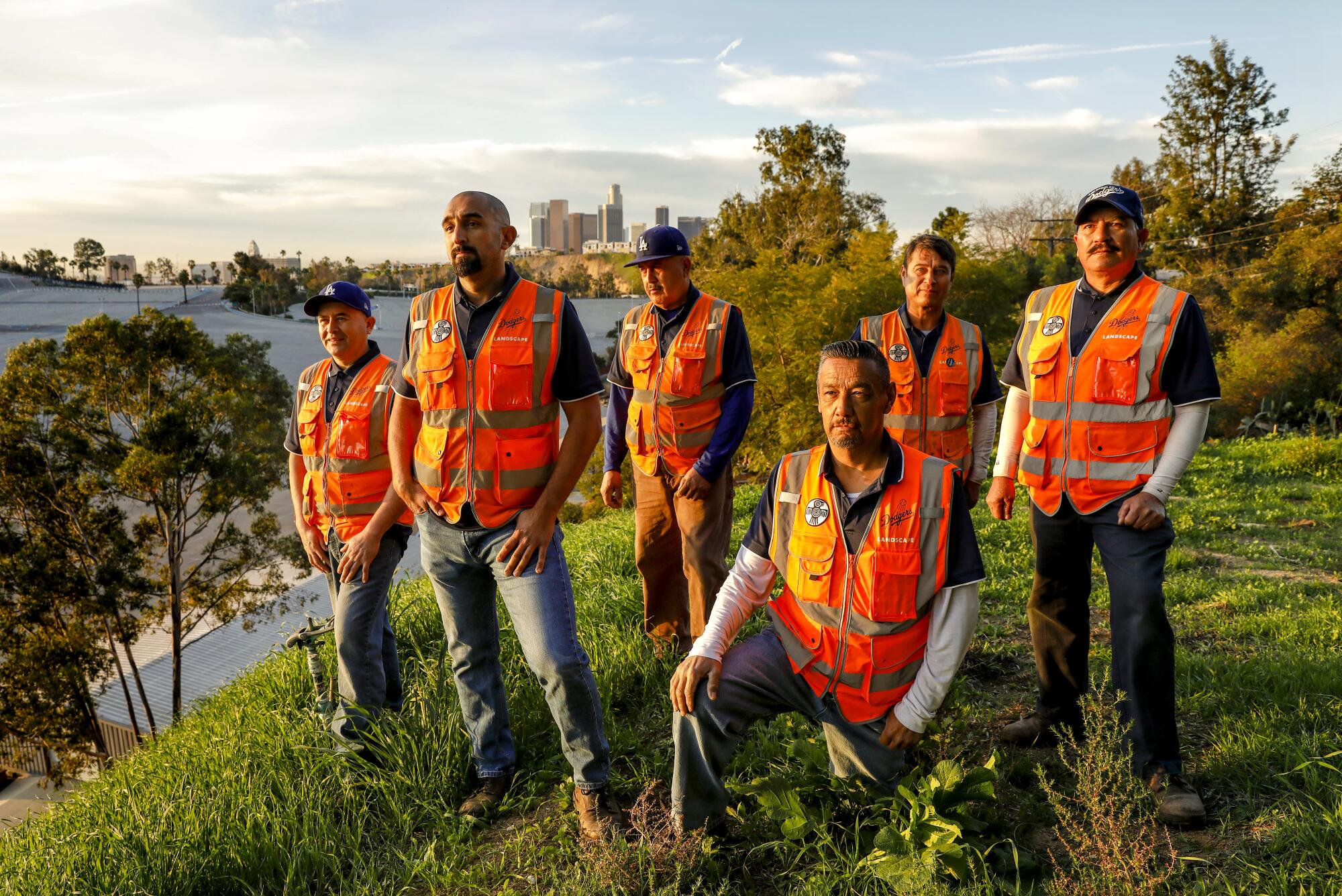 Chaz Perea, director of landscaping at Dodger Stadium, second from left, is photographed with his landscaping team