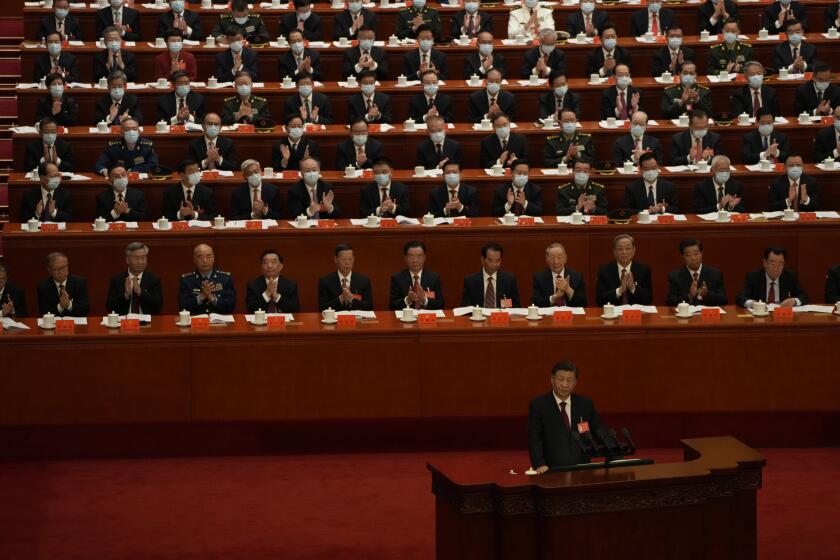 Delegates applaud as Chinese President Xi Jinping speaks during the opening ceremony of the 20th National Congress of China's ruling Communist Party held at the Great Hall of the People in Beijing, China, Sunday, Oct. 16, 2022. China on Sunday opens a twice-a-decade party conference at which leader Xi Jinping is expected to receive a third five-year term that breaks with recent precedent and establishes himself as arguably the most powerful Chinese politician since Mao Zedong. (AP Photo/Mark Schiefelbein)