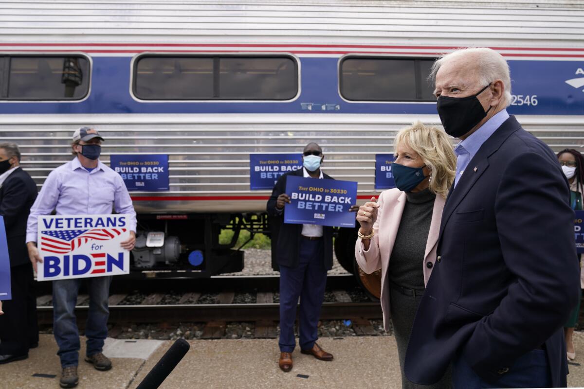 Democratic presidential candidate Joe Biden and Jill Biden before boarding a train