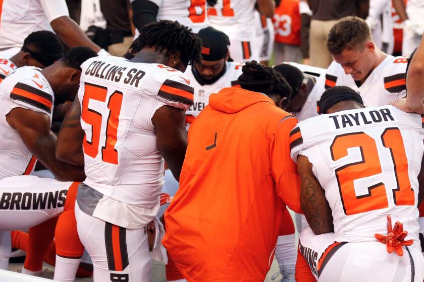 Members of the Cleveland Browns kneel during the national anthem before an NFL preseason football game between the New York Giants and the Cleveland Browns, Monday, Aug. 21, 2017, in Cleveland. (AP Photo/Ron Schwane)