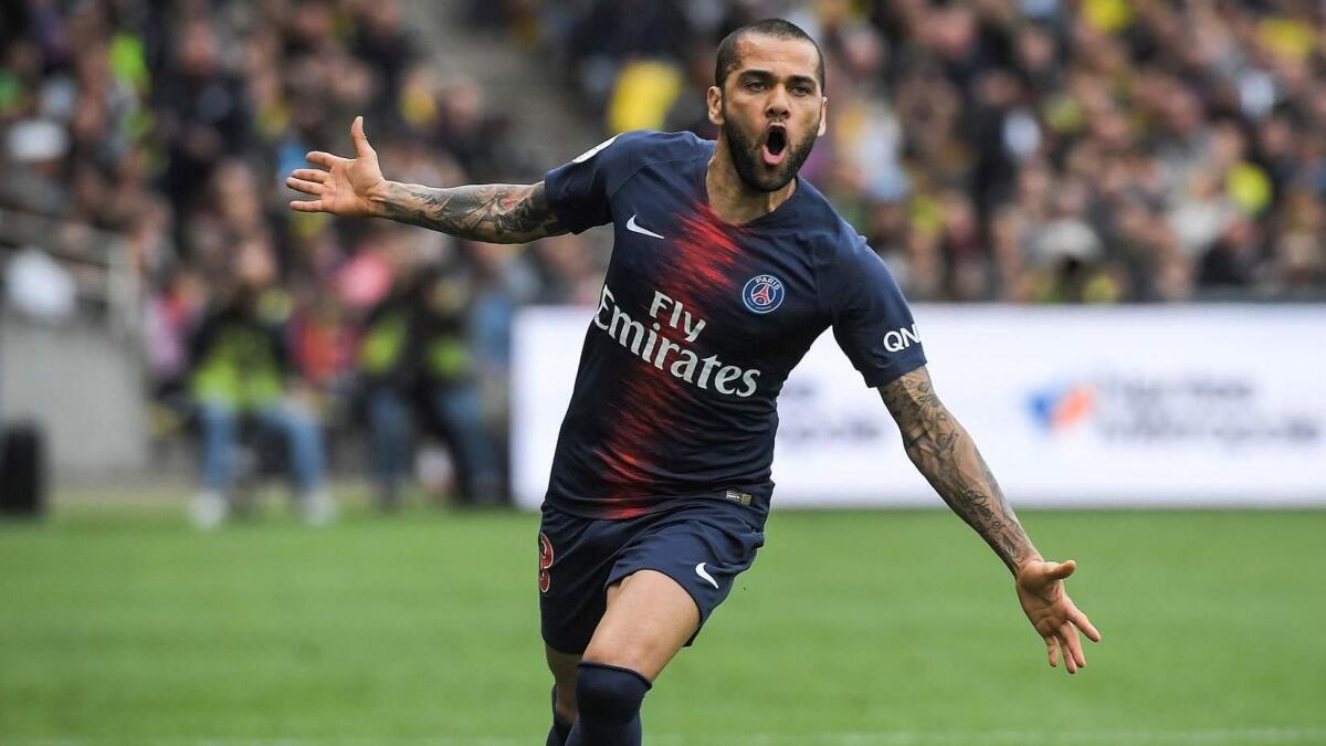 Paris Saint-Germain defender Dani Alves celebrates after scoring during a match against FC Nantes on April 17.