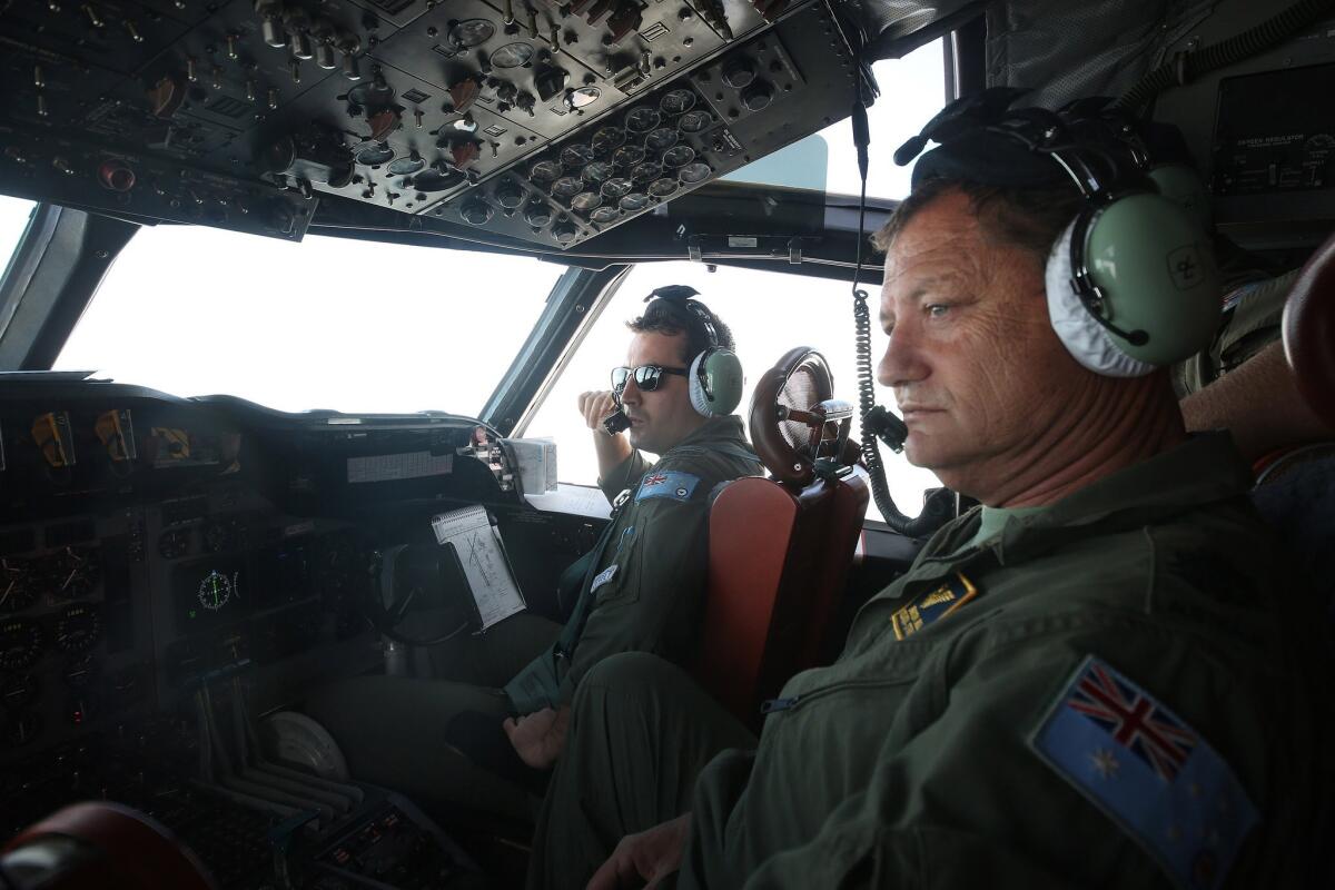 The crew of a Royal Australian Air Force AP-3C Orion aircraft participates in the search for Malaysia Airlines Flight 370 in the southern Indian Ocean.