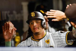 San Diego, CA - April 30: San Diego Padres designated hitter Manny Machado (13) celebrates in the dugout after scoring a run against the Cincinnati Reds during the fifth inning at Petco Park on Tuesday, April 30, 2024 in San Diego, CA. (Meg McLaughlin / The San Diego Union-Tribune)