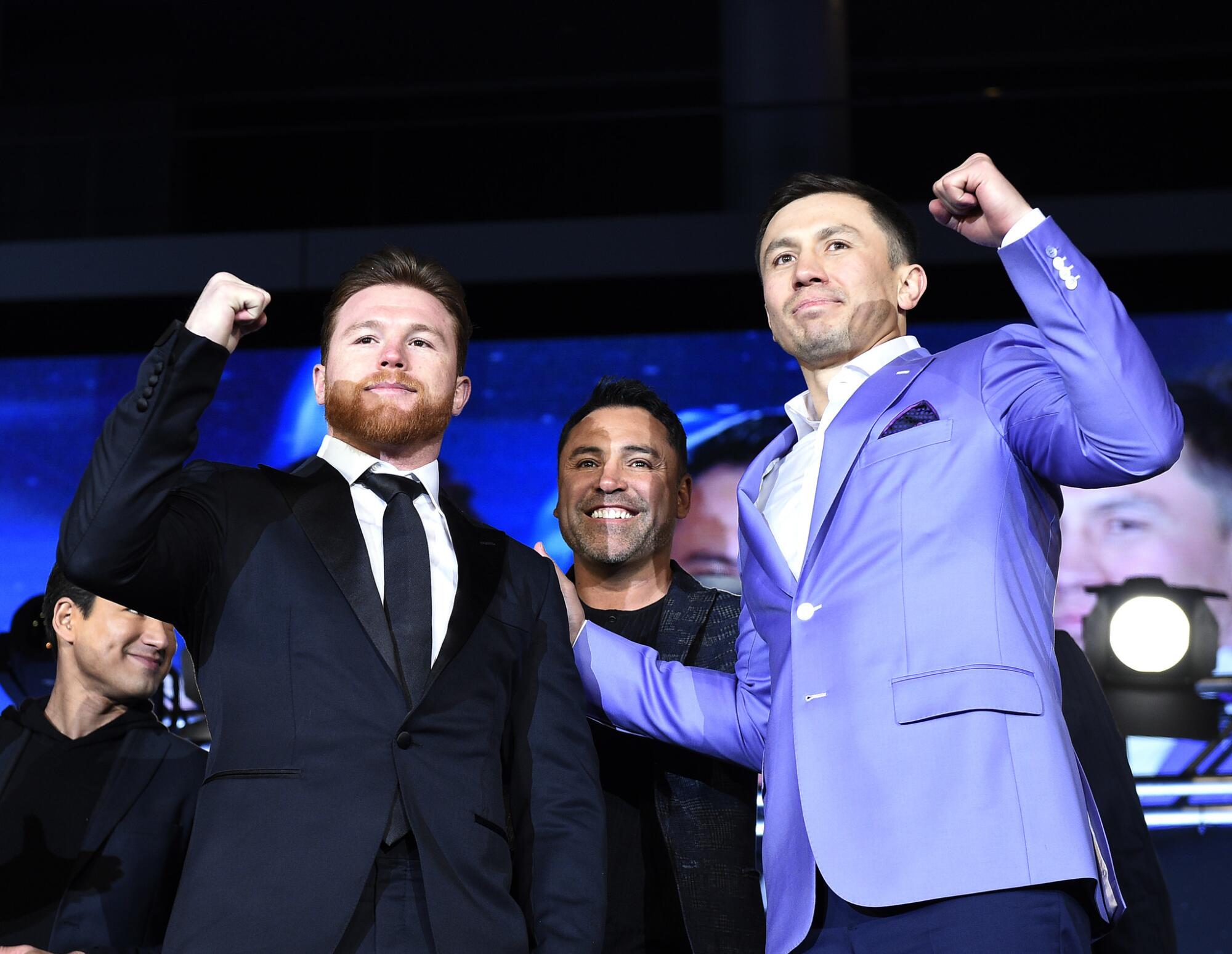 Saul "Canelo" Alvarez, left, Oscar De La Hoya, center, and Gennady Golovkin pose before a fight in 2017