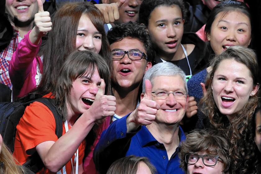 Apple Chief Executive Tim Cook interacts with high-schoolers at an Apple developers’ event in June.