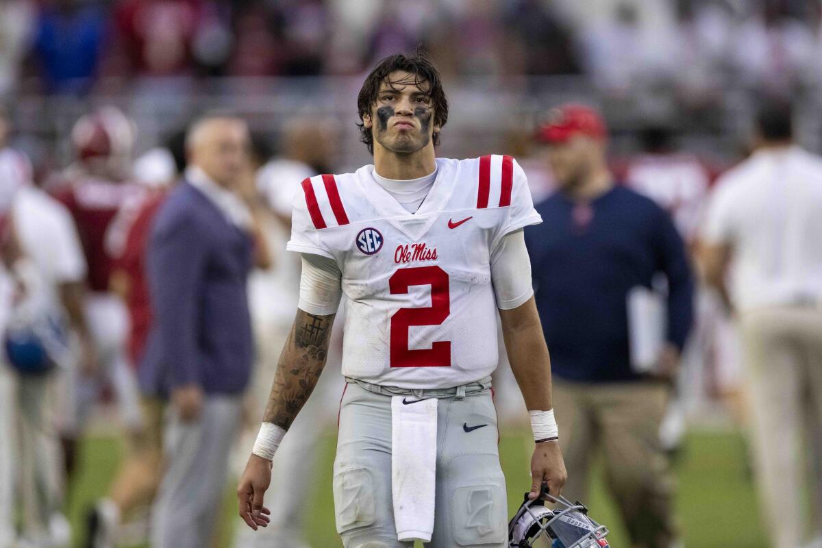 Mississippi quarterback Matt Corral (2) walks off the field after a 42-21 loss to Alabama during the second half of an NCAA college football game, Saturday, Oct. 2, 2021, in Tuscaloosa, Ala. (AP Photo/Vasha Hunt)