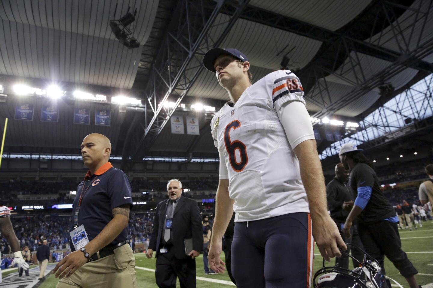 Jay Cutler walks off the field after the Bears lost to the Detroit Lions, 37-34, in overtime at Ford Field.