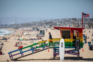 Hermosa Beach, CA - June 21: People flocked to the sand in Hermosa Beach, CA, on the first day of summer, Wednesday, June 21, 2023. (Jay L. Clendenin / Los Angeles Times)