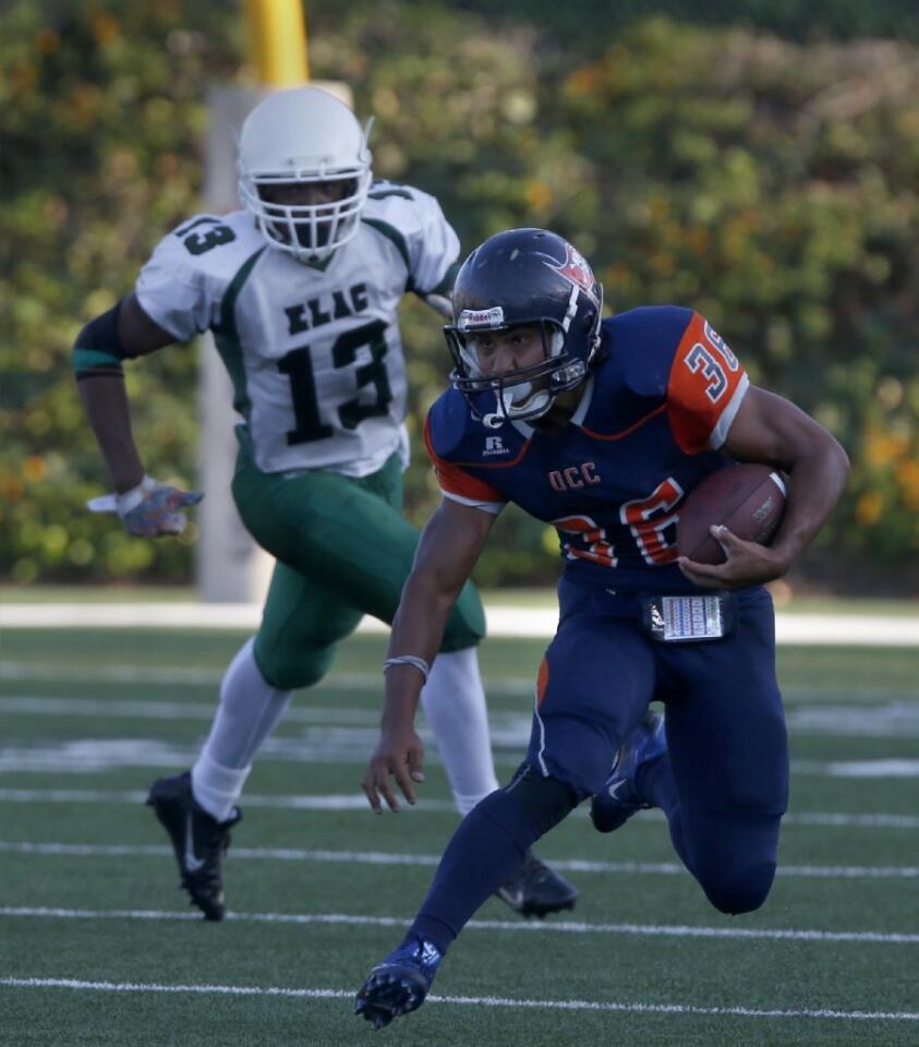 Orange Coast College running back John Simon (36) makes for a five-yard gain against East Los Angeles College on Saturday.