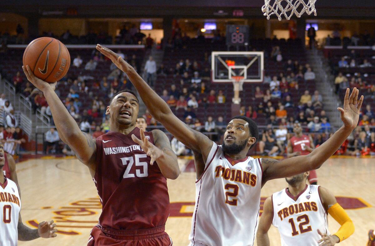 Washington State guard DaVonte Lacy shoots over USC forward Malik Martin during the Cougars' 70-66 victory at the Galen Center.