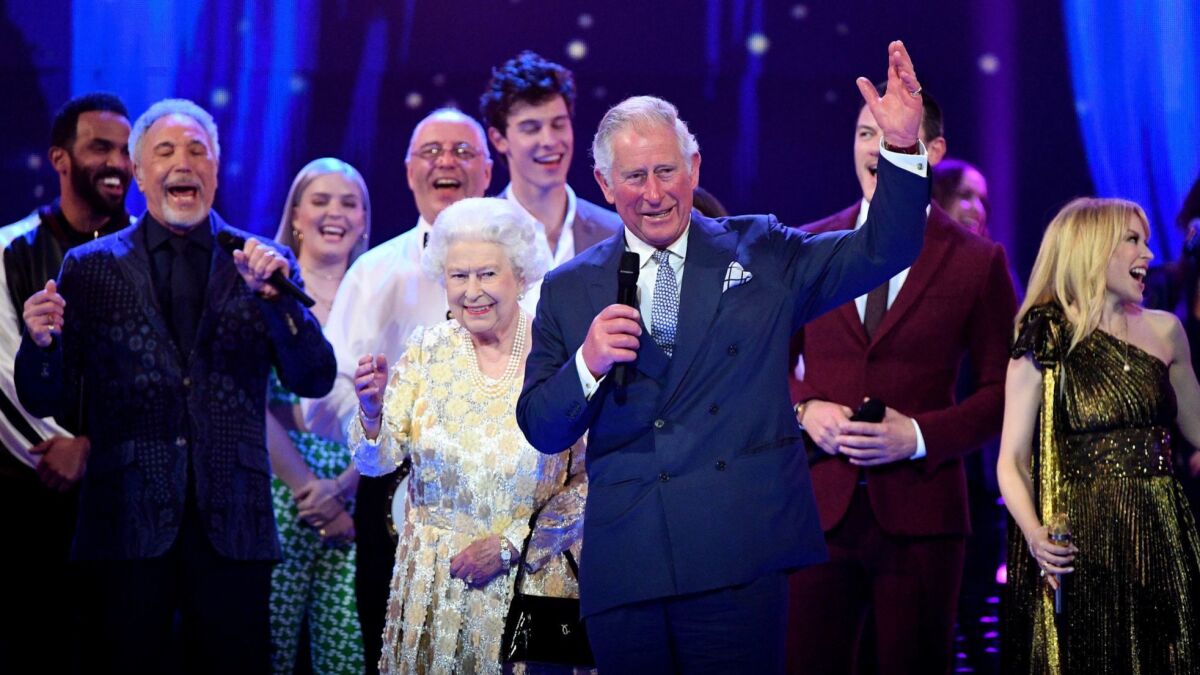 Prince Charles makes a speech for Queen Elizabeth II at a star-studded concert to celebrate her 92nd birthday at the Royal Albert Hall on Saturday in London.