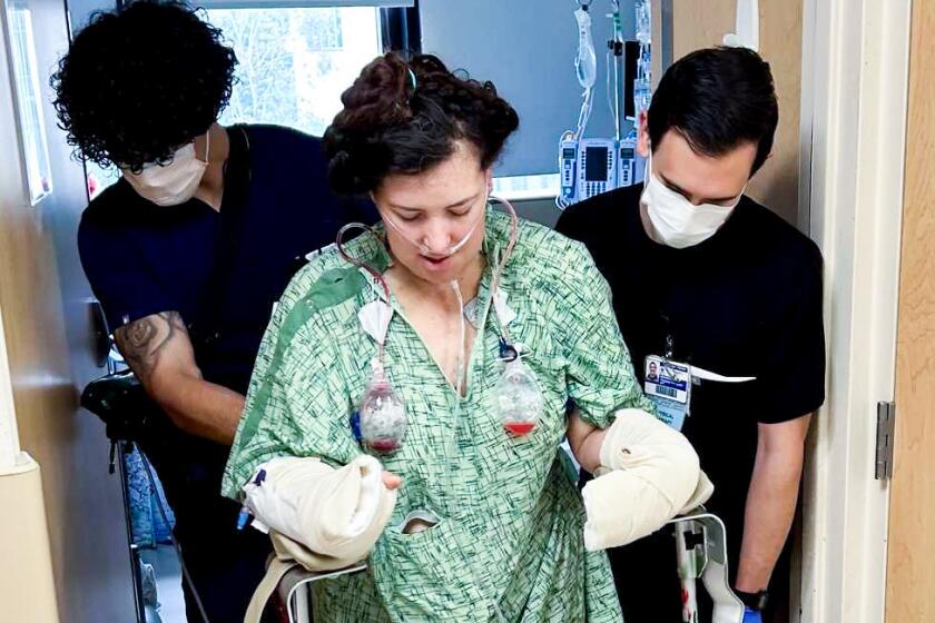 Makeup artist Allie Shehorn, center, recovers in a Southern California hospital after being repeatedly stabbed in her Sun Valley home on May 23, 2024. Los Angeles County prosecutors allege that she was attacked by her ex-boyfriend and actor Nick Pasqual, who has been charged with attempted murder and other charges.