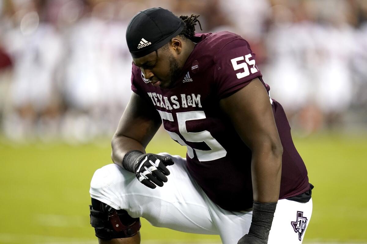 Texas A&M offensive lineman Kenyon Green kneels before an October game against Alabama.