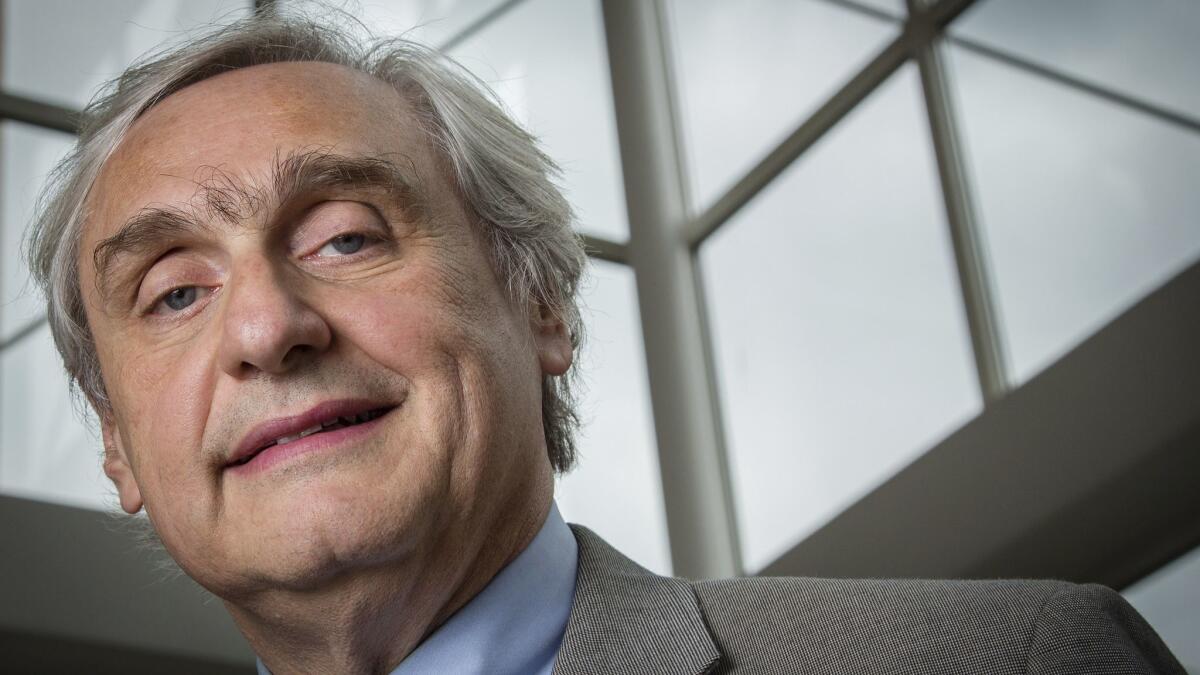 In this July 24, 2014, file photo, then-Chief Judge of the U.S. Court of Appeals for the 9th Circuit Alex Kozinski poses for a portrait in the lobby of a Washington office building.