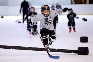 MEXICO CITY, - MARCH 23: Players with the Mexico City Jr. Kings youth hockey league skate through training drills at the ice skating rink in Centro Santa Fe shopping mall in the Santa Fe neighborhood on Wednesday, March 23, 2022 in Mexico City. Mexico City Jr. Kings is a youth hockey league that has been organized and supported by the Los Angeles Kings in an effort to grow the game in Mexico, an untapped market. (Gary Coronado / Los Angeles Times)