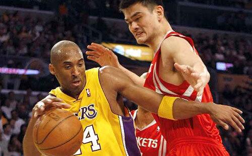Lakers guard Kobe Bryant tries to drive around Rockets center Yao Ming in the first half Friday night.