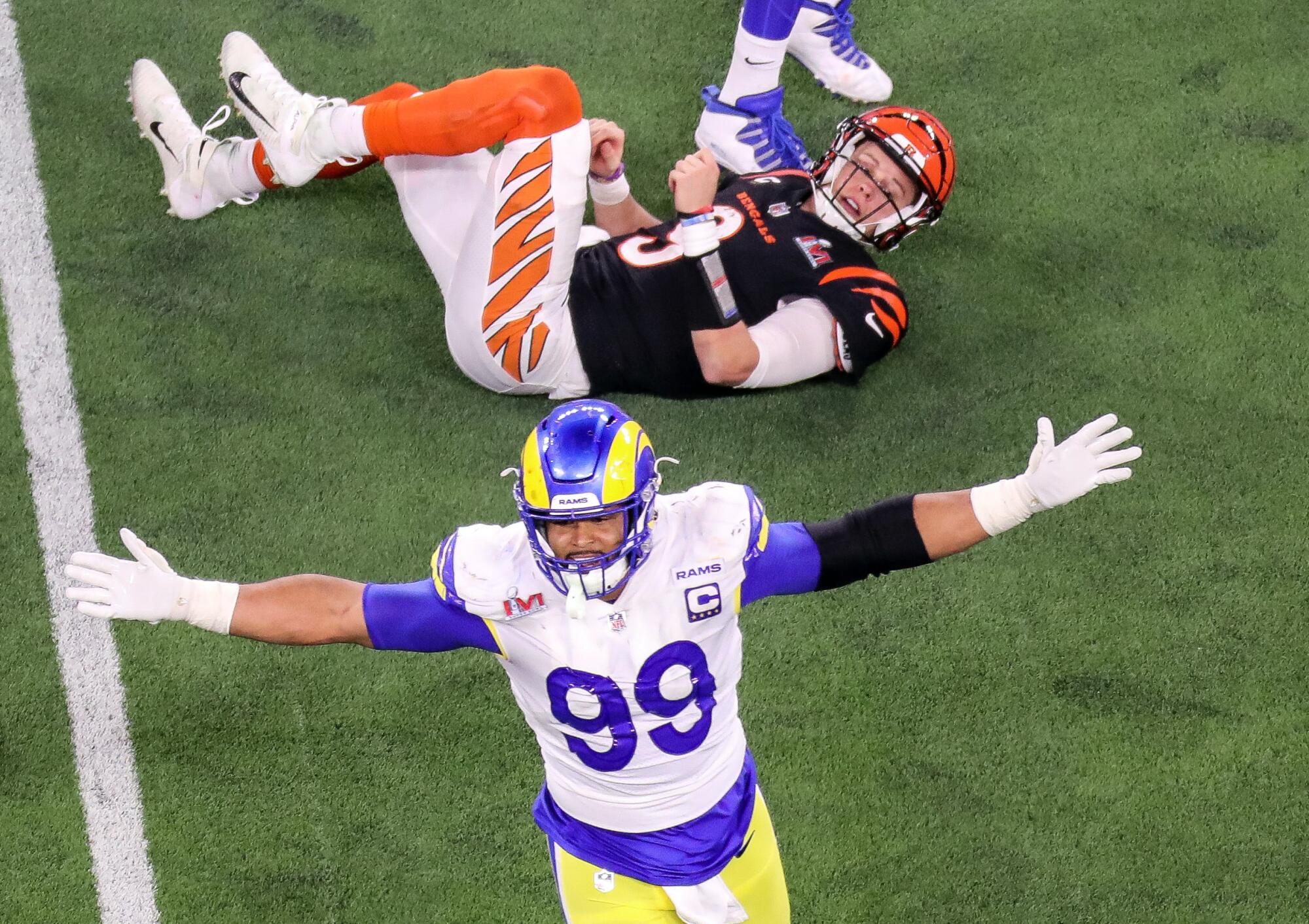 Rams defensive end Aaron Donald (99) celebrates his tackle of Cincinnati Bengals quarterback Joe Burrow