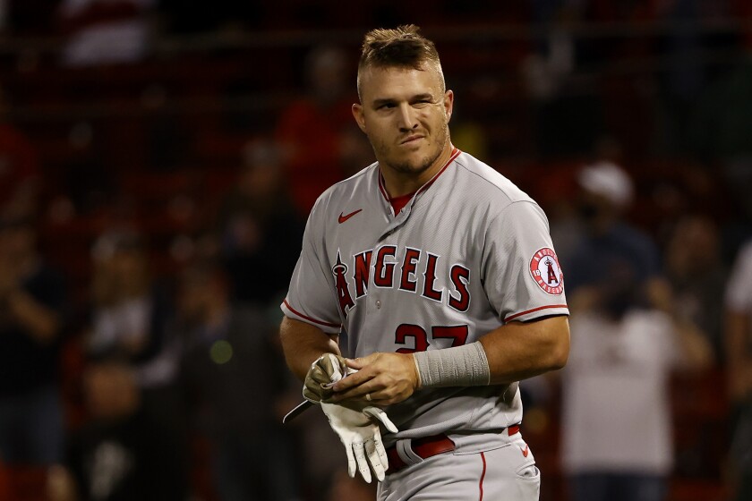 Los Angeles Angels' Mike Trout looks toward the dugout after striking out during the eighth inning of a baseball game against the Boston Red Sox, Friday, May 14, 2021, at Fenway Park in Boston. (AP Photo/Winslow Townson)